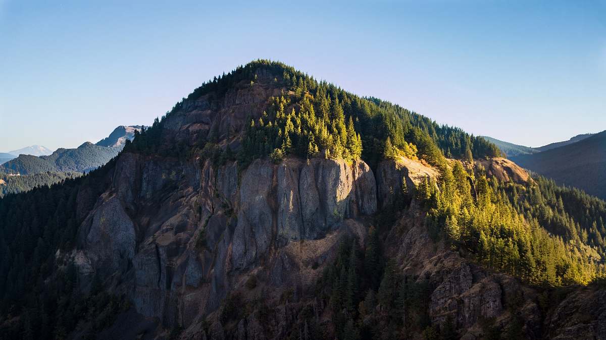 mountain range mountain under blue sky crest